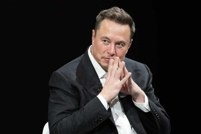 shutterstock_2318800287 man in a suit with hands clasped thoughtfully