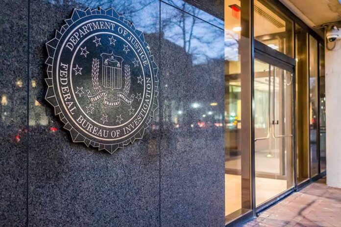 FBI emblem on a stone wall beside a glass entrance
