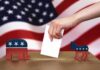 Donor Hack Upends Pennsylvania Politics Hand casting ballot between Republican elephant and Democratic donkey