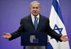 UN Floor ERUPTS Over Gaza Claims man in suit speaking at a podium with Israeli flag