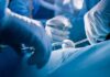 Taxpayer Cash Torched On Ghost Organs Surgeons' gloved hands performing an operation