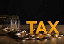 Tax Time Bomb Targets Billionaires Yellow TAX letters among coins and a tipped jar