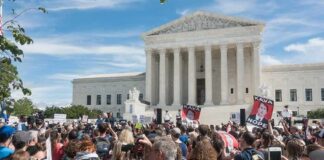 Brett Kavanaugh and Christian Jones at protest outside the U.S. Supreme Court