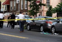 Georgia Teen Caught After Torso Drop Police at urban street crime scene with yellow tape around parked cars