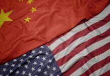 Trump – Xi Showdown: What’s Really at Stake? China and United States flags overlapping