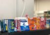 Trusted Painkiller, Hidden Danger Over-the-counter medicine boxes on a store shelf