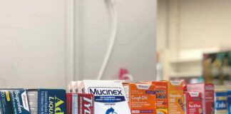 Over-the-counter medicine boxes on a store shelf