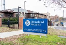 Killings Spark DHS Warning To Virginia Homeland Security sign outside a fenced government building