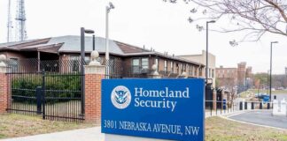 Homeland Security sign outside a fenced government building
