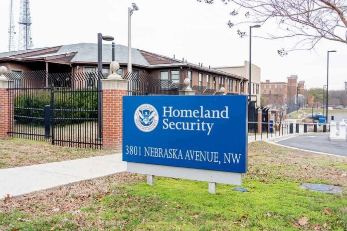 shutterstock_1698828346 Homeland Security sign outside a fenced government building