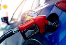 Gas Stations Promoted by Trump Got Free Gas? Red gasoline nozzle fueling a blue car