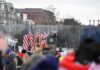 speaker at presidential podium addressing crowd outdoors