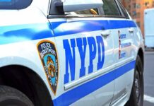 NYC City Hall’s Ticket Factory Fail NYPD police car side with blue stripes and emblem