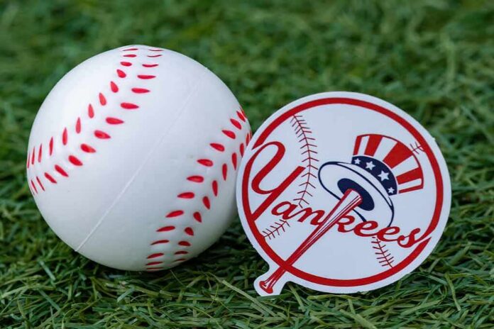 shutterstock_2208270769 Baseball and team logo sticker on grass