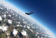 10,000-Foot Horror Ends With a Thud Skydiver freefalling above clouds and landscape