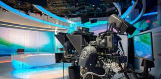 robotic television cameras on a modern news studio set