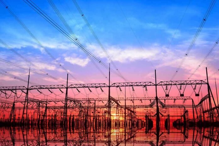 shutterstock_536505745 Electrical substation with power lines at sunset