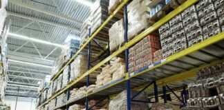 Interior view of a warehouse with stacked shelves of packaged goods