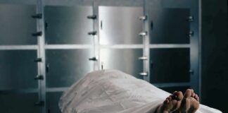 Body on a morgue gurney with toe tag