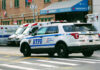 Grim Drive Ends In Chilling Admission Police car and ambulances outside emergency room entrance.