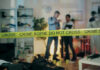 Fake Cocaine Delivery Tied To Dorm Death Crime scene with tape and investigators examining evidence.