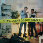 Fake Cocaine Delivery Tied To Dorm Death Crime scene with tape and investigators examining evidence.