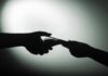 Food Stamp Heist Inside County Office hands exchanging cash