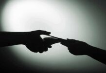 hands exchanging cash