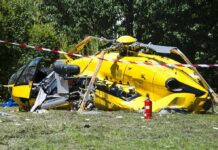 Helicopter Training Flight Turns Deadly yellow helicopter crash scene on grassy field