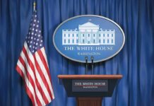 Trump’s New Enforcer Hits The Podium White House press briefing podium and US flag