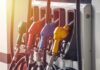 Fuel pump nozzles in multiple colors at a gas station