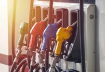 Fuel Tax Holiday – Trump Drops The Hammer Fuel pump nozzles in multiple colors at a gas station