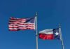 American and Texas flags waving on flagpoles