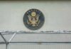Red Sea Chaos Triggers Embassy Pullback U.S. embassy seal on a building wall