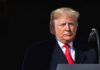 Election Clock Halts Iran Escalation Donald Trump at a podium with a microphone
