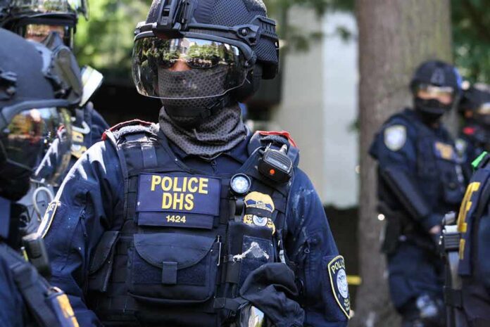 shutterstock_1801253857 Riot police officer in tactical gear with helmet and visor