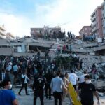 27 Children Die In School Disaster Rescue workers and civilians on collapsed building after earthquake