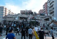 27 Children Die In School Disaster Rescue workers and civilians on collapsed building after earthquake