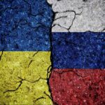 Claims Fly: 30-Day Deal Already Bleeding Ukraine and Russia flags divided by cracked line