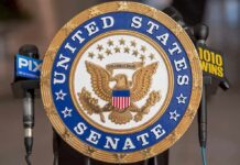 Senator Demands Signature Scalp Cases United States Senate seal at a podium