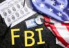 FBI Snags Alleged China Spy At LAX FBI letters with fingerprint sheet, badge, magnifying glass, and US flag