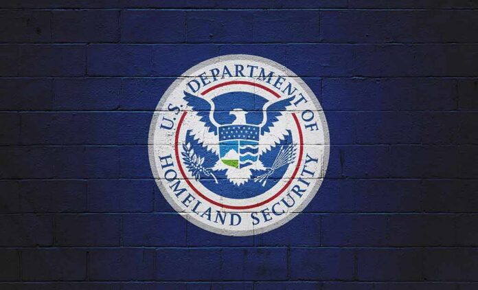 shutterstock_2259540171 U.S. Department of Homeland Security seal on a blue brick wall