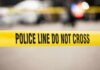Kids Hit As Gunman Storms Yellow police tape reading 'POLICE LINE DO NOT CROSS' at a cordoned area