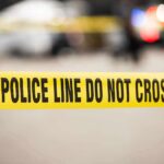 Kids Hit As Gunman Storms Yellow police tape reading 'POLICE LINE DO NOT CROSS' at a cordoned area