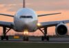 Cabin Panic As Cockpit Attack Unfolds Front view of a commercial airplane on runway at sunset